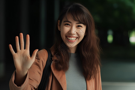 正在微笑挥手的女孩背景图片