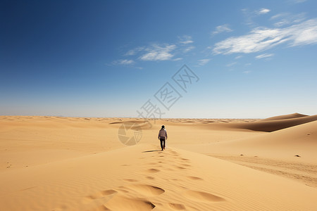 走在沙漠上的人一个人在沙漠上行走背景