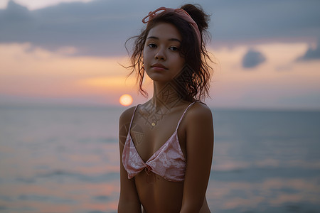 海边夕阳下的女性背景图片