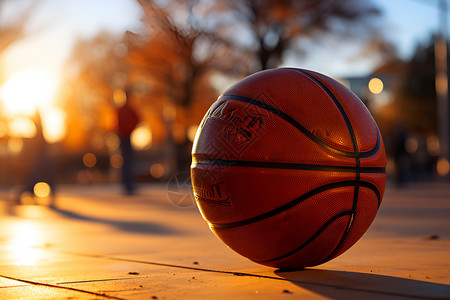 黄昏下的篮球背景图片
