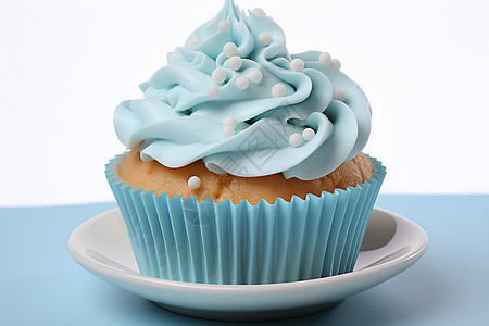 蓝色的蛋糕杯子糖衣的高清图片