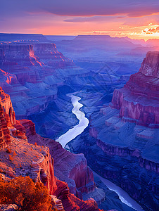 日出中蜿蜒的峡谷河流背景图片