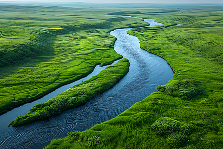 草原中的美丽河流背景图片