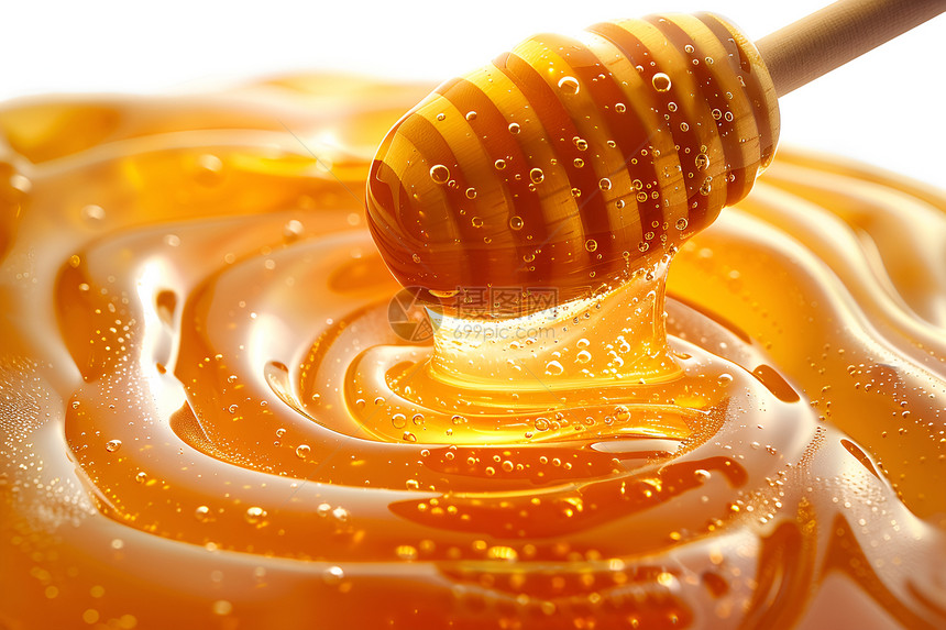 蜂蜜勺上的蜂蜜图片